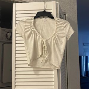 White crop top. Tie in the front. Size small